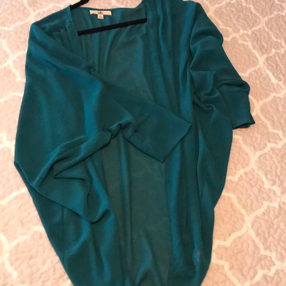 Sheer cardigan. Dark teal with a cuffed sleeve.